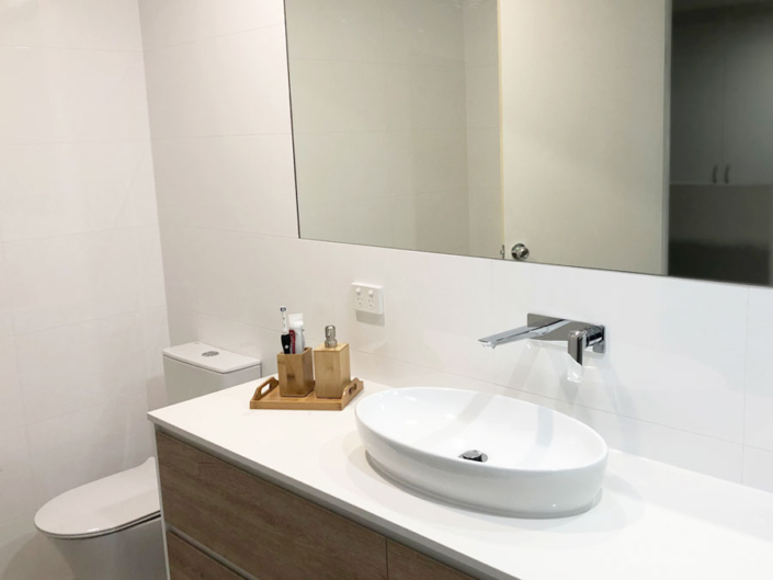 New Modern Bathroom Renovation with mirror and vanity - Gold Coast Builders - Coastal Modern Builders